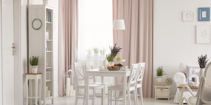 White furniture with pale pink curtains